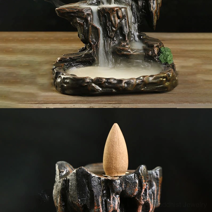 Buddhist incense burner on wooden table, side view with smoke pooling in base tray, dark brown mountain tower design