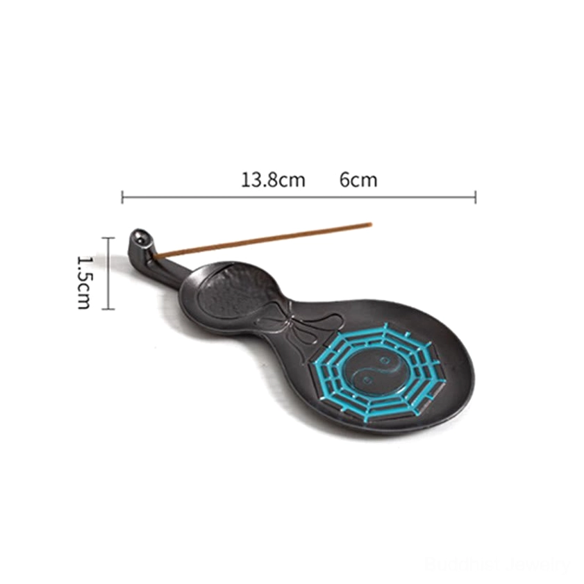 Handcrafted gourd incense holder featuring Bagua eight trigrams symbol in cyan with protective spiritual meaning