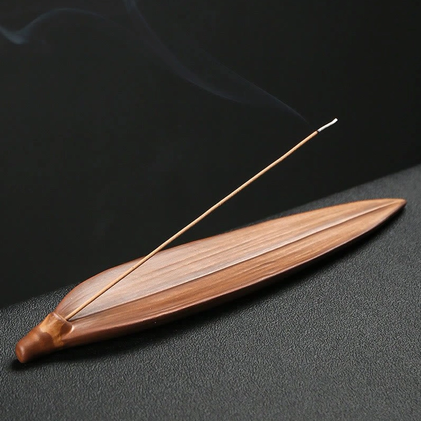 Bamboo design ceramic incense holder, leaf-shaped boat form, top-down flat lay view