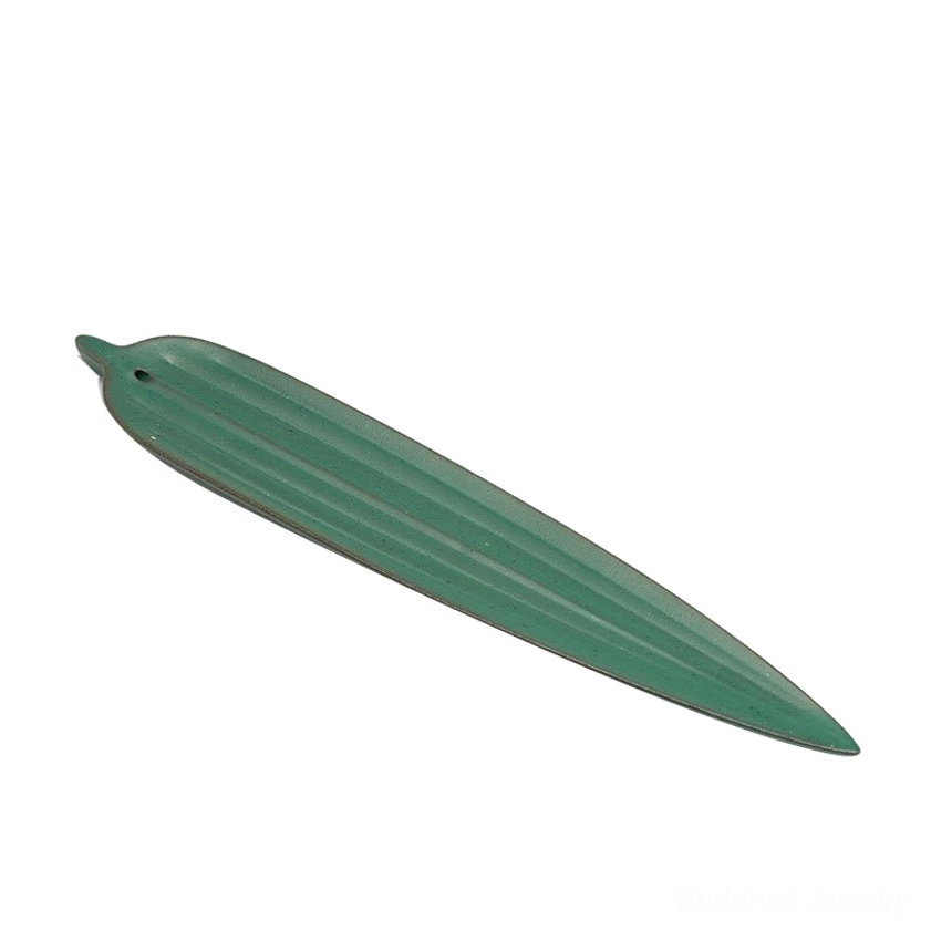 Side view of matte green bamboo leaf incense holder with ribbed texture on white background