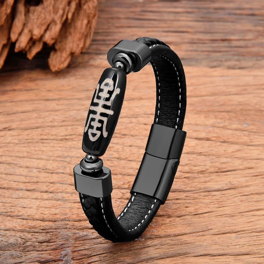Beige Nine-Eye Dzi Bead bracelet with longevity script pattern and black metal fastener, side profile view