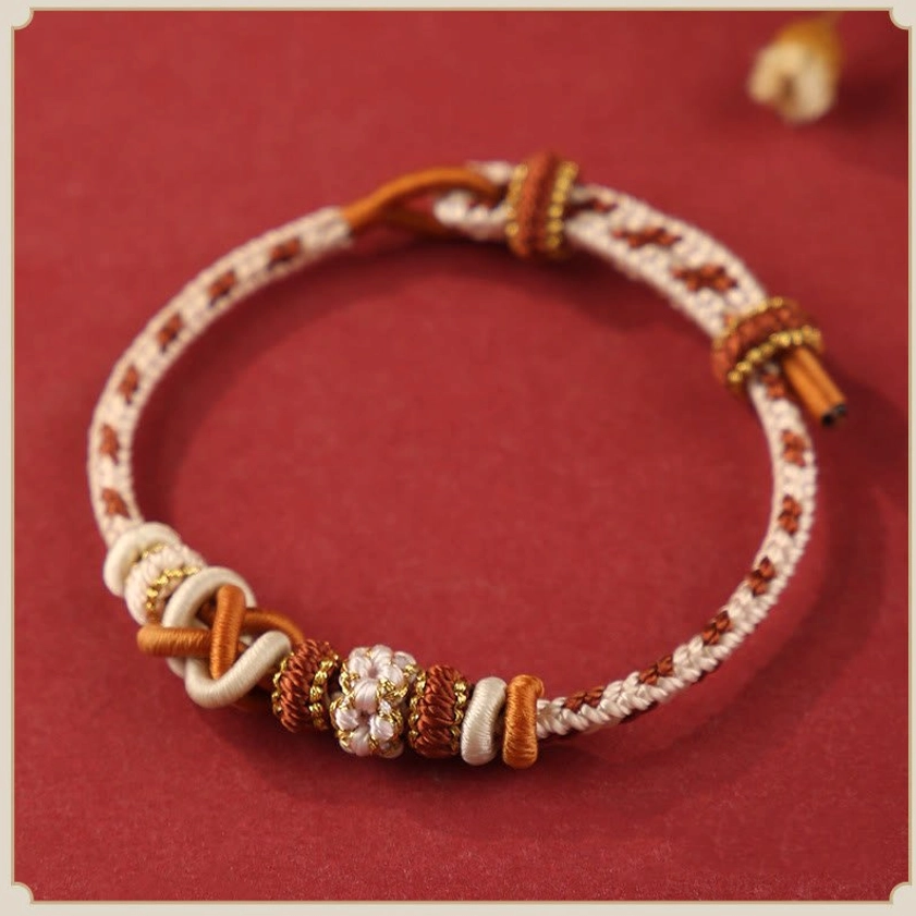 Beige and warm neutral tone peace knot Buddhist bracelet with brown and gold woven details for grounding and balance