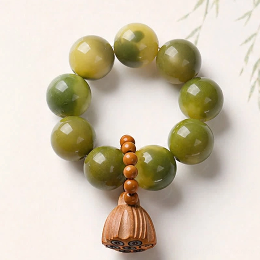 Black style bodhi seed bracelet with smooth polished round beads and carved lotus decoration