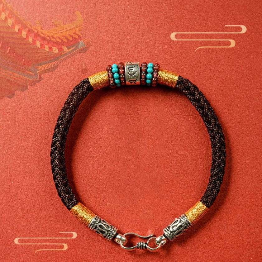 Black braided Buddhist bracelet with sterling silver engraved accessories and mantra bead