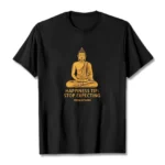 Black Buddha mindfulness graphic t-shirt with golden seated Buddha print and 'Stop Expecting From Others' text, front flat lay view on white background