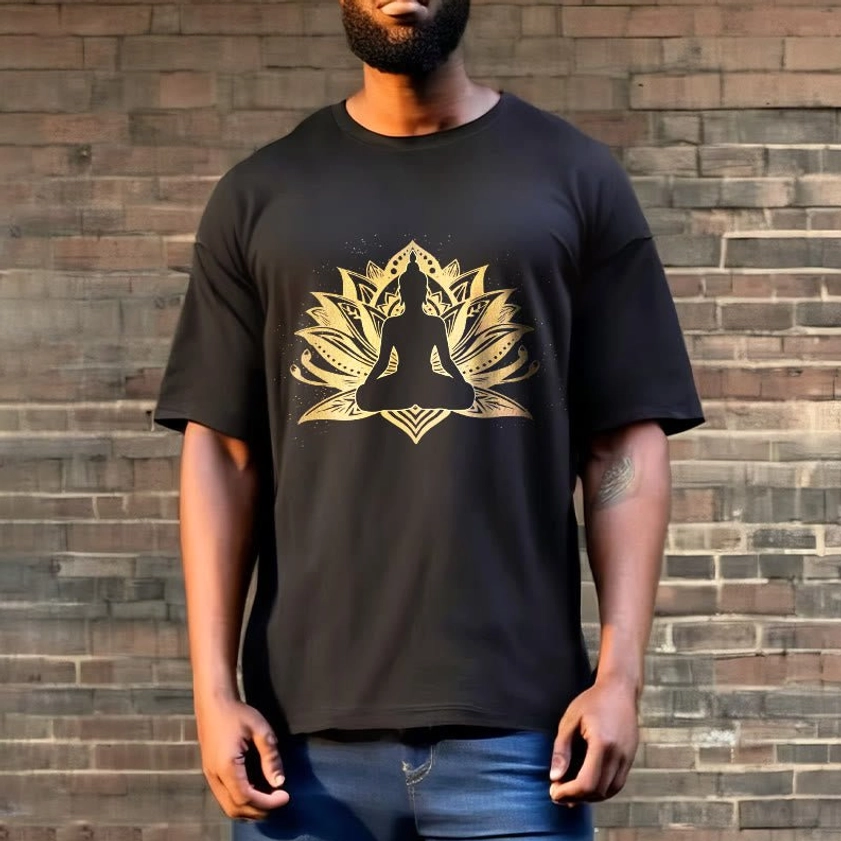 Male model wearing black Buddha lotus meditation t-shirt with gold print, full front view, outdoor brick wall setting