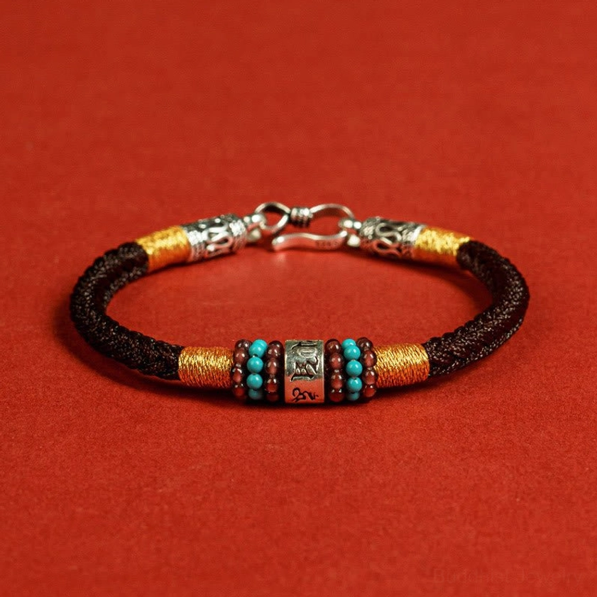 Black Buddhist string bracelet with silver lock clasp and engraved mantra center bead