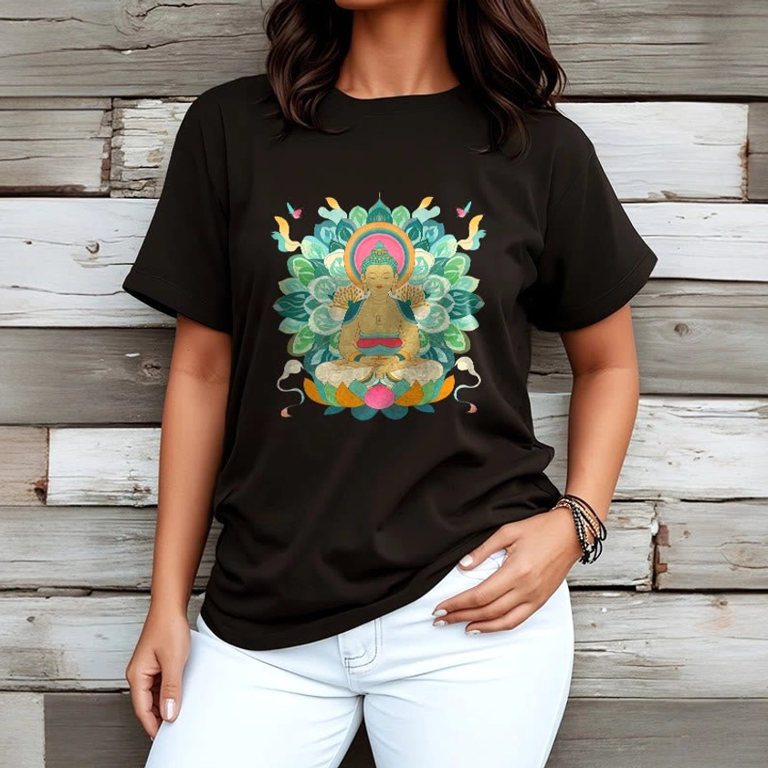 Woman wearing black Buddhist lotus graphic tee with white denim pants ethnic spiritual print wooden wall