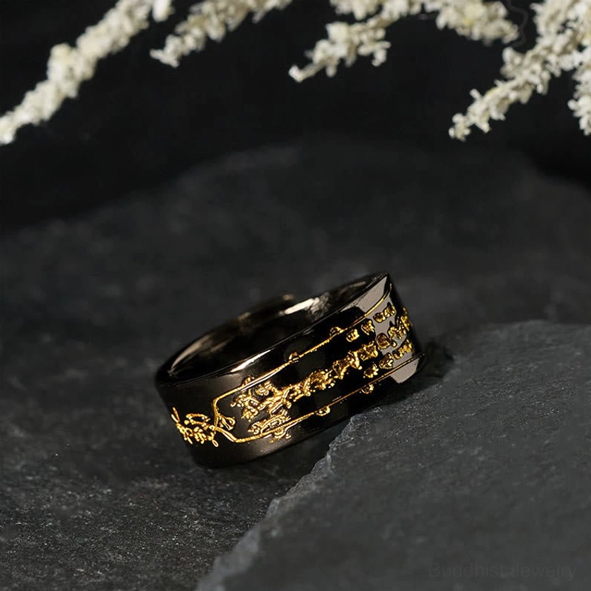 Black copper adjustable talisman ring rear three-quarter view showing curved band structure and gold talisman pattern details