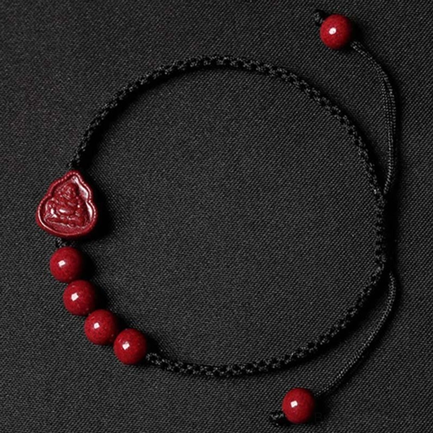 Black cord cinnabar Buddha blessing bracelet featuring red beads and Buddha charm, adjustable wrist size