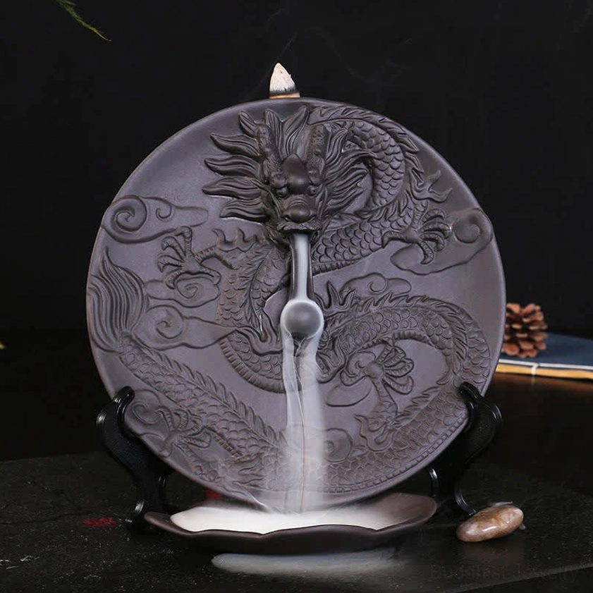 Dark grey dragon backflow incense burner showing cascading smoke effect in home setting