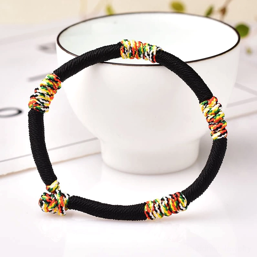 Black fixed Buddhist protection bracelet with King Kong knot for spiritual defense and good fortune