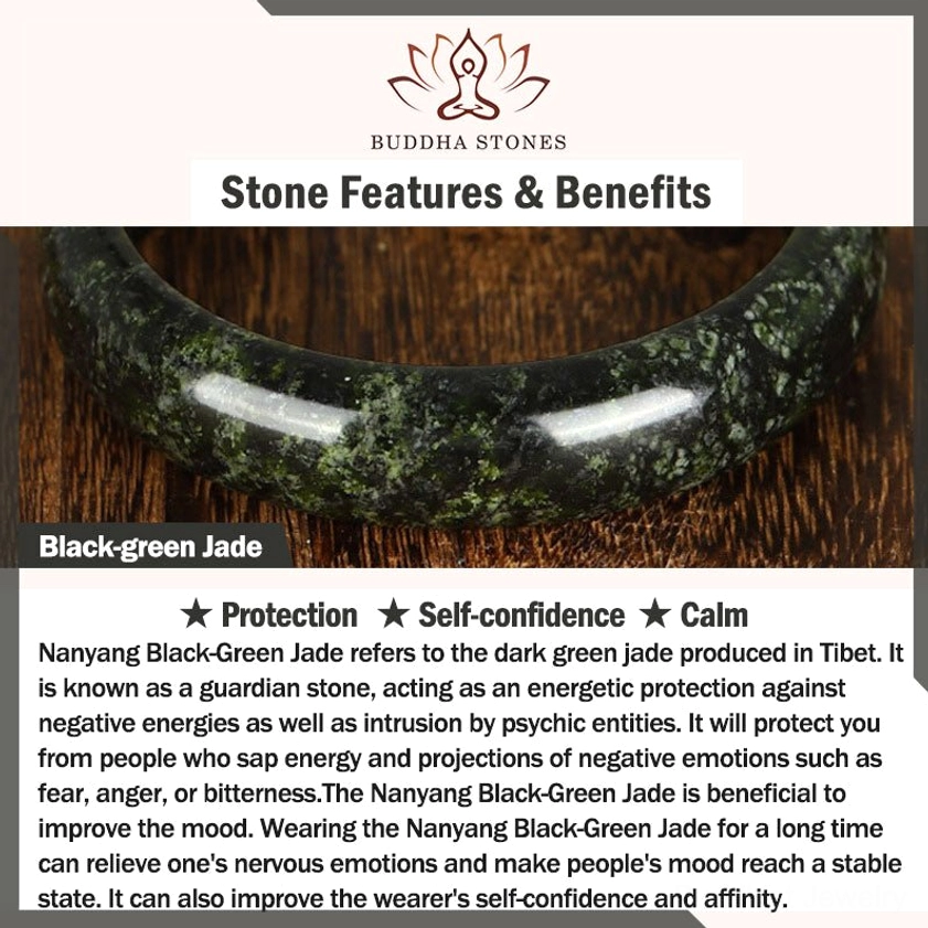 Black-green jade stone bangle bracelet showing dark speckled texture and natural jade characteristics on wooden surface