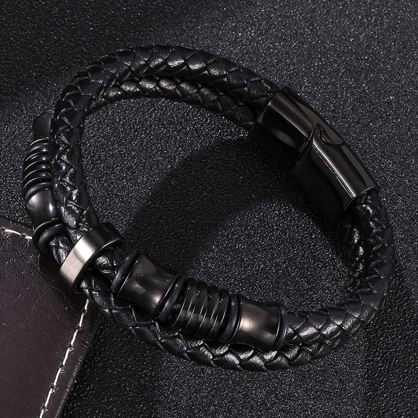 Black leather weave bracelet flat lay displaying magnetic stainless steel clasp and braided texture