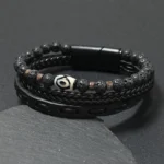 Black leather nine-eye dzi bead lava rock bracelet with magnetic clasp top view