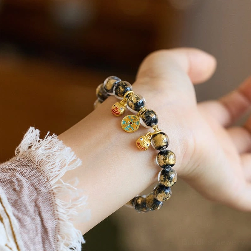 Black and clear liuli glass bead Buddhist protection bracelet with gold pixiu swallowing beast charm