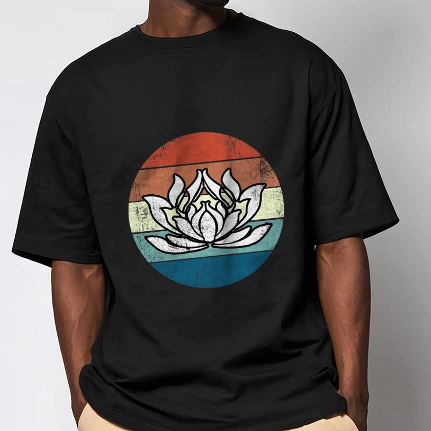 Man modeling black lotus spiritual t-shirt with retro striped pattern in studio setting