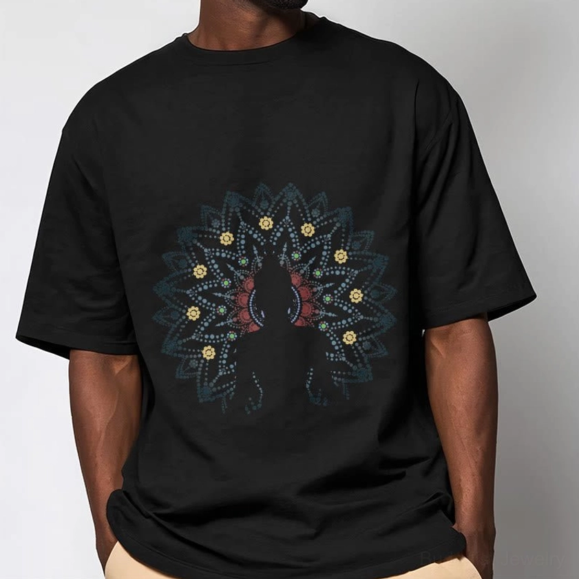 Man wearing black mandala Buddha cotton tee close-up detail shot of printed spiritual artwork