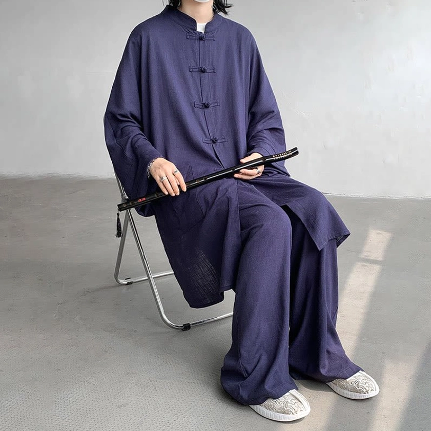 Black Buddhist zen meditation outfit front pose showing traditional frog buttons and natural cotton fabric