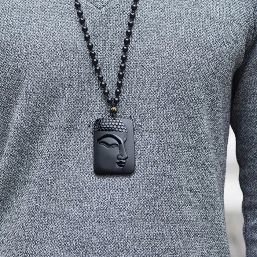 Protective Black Obsidian Buddha Pendant Necklace - Worn on model showing subtle Buddha face carving and wearability on thin beaded chain