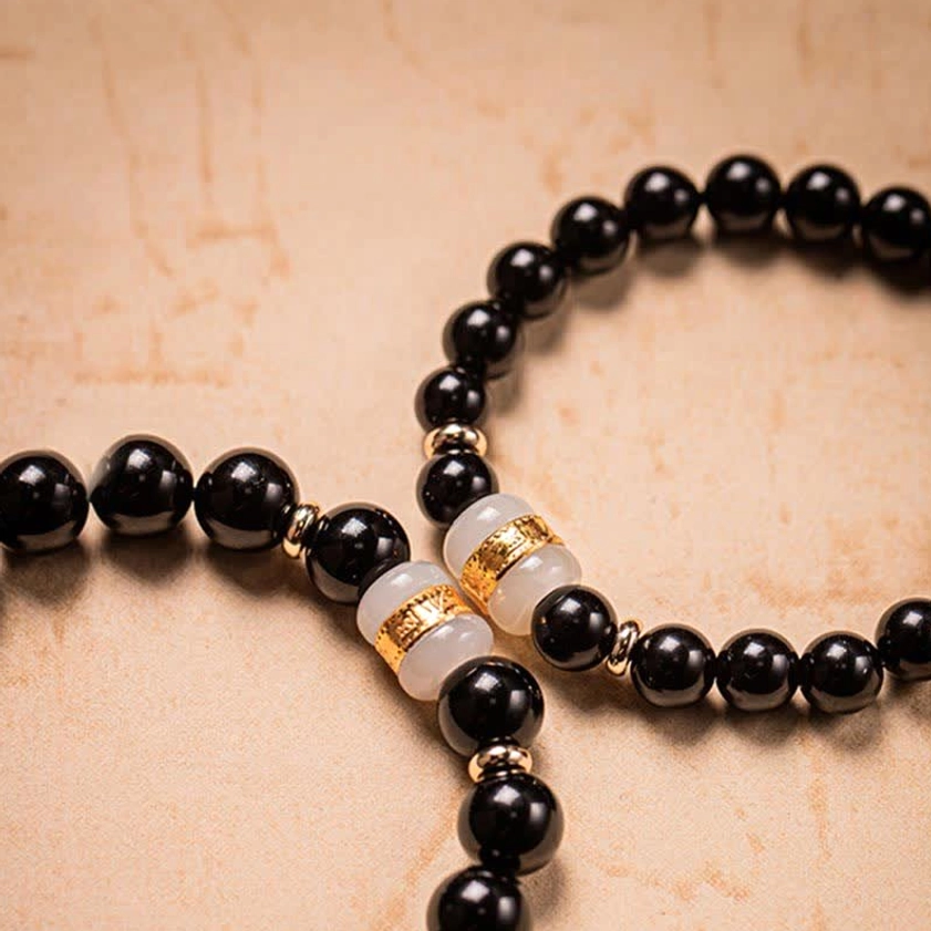 Black obsidian and jade protective energy bracelet with natural healing properties for emotional balance and inner peace
