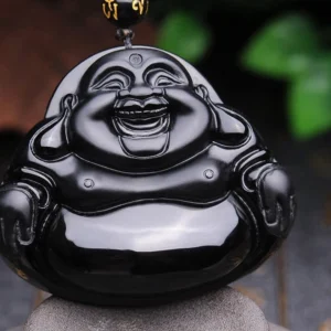 Black Obsidian Laughing Buddha pendant necklace - front close-up view showing polished glossy finish and hand-carved Maitreya Buddha face