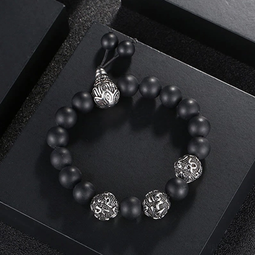 Black obsidian Buddhist mantra bracelet highlighting purification and transformation properties with engraved titanium steel beads
