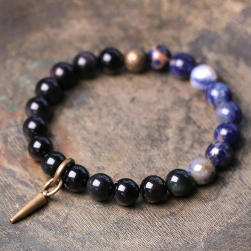 Black Obsidian and Sodalite couples crystal bracelet with copper spike pendant - top-down close-up view