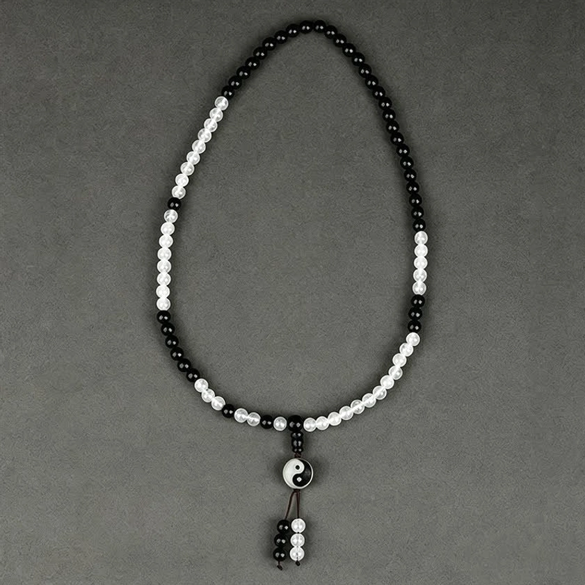 Looped Black Obsidian Yin-Yang beaded bracelet with center charm and tassel detail