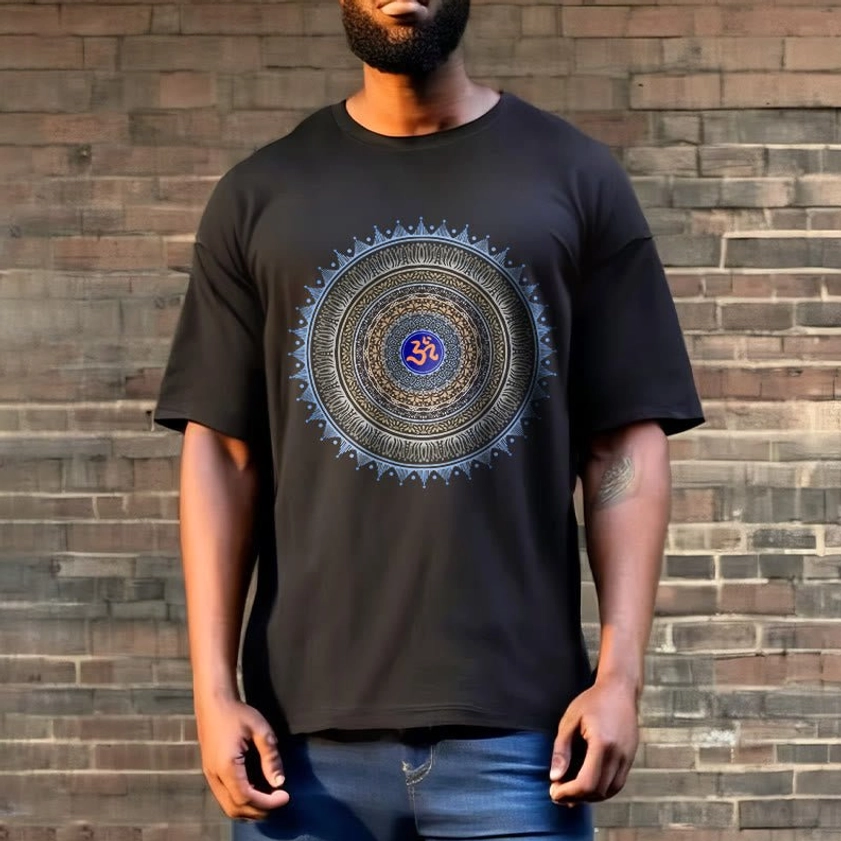Unisex black graphic t-shirt with blue OM mandala design worn outdoors, Buddhist spiritual apparel