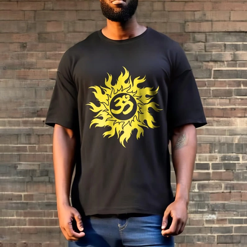 Full body view man wearing black Om sun Buddhist t-shirt with blue jeans, outdoor brick wall setting