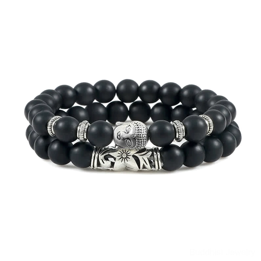 Black onyx Buddhist protection bracelet with matte stone beads and engraved metal spiritual accents