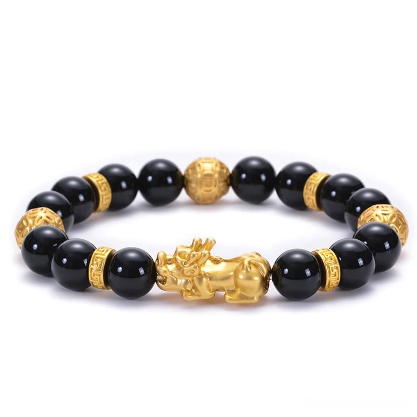 Black onyx golden alloy Pi Xiu Buddhist strength and protection bracelet close-up view
