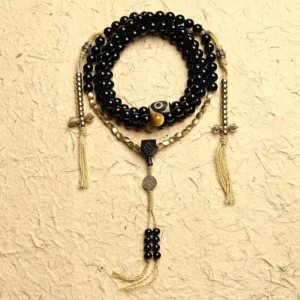 108 black onyx mala beads bracelet with three-eyed dzi bead flat lay display showing complete handcrafted set