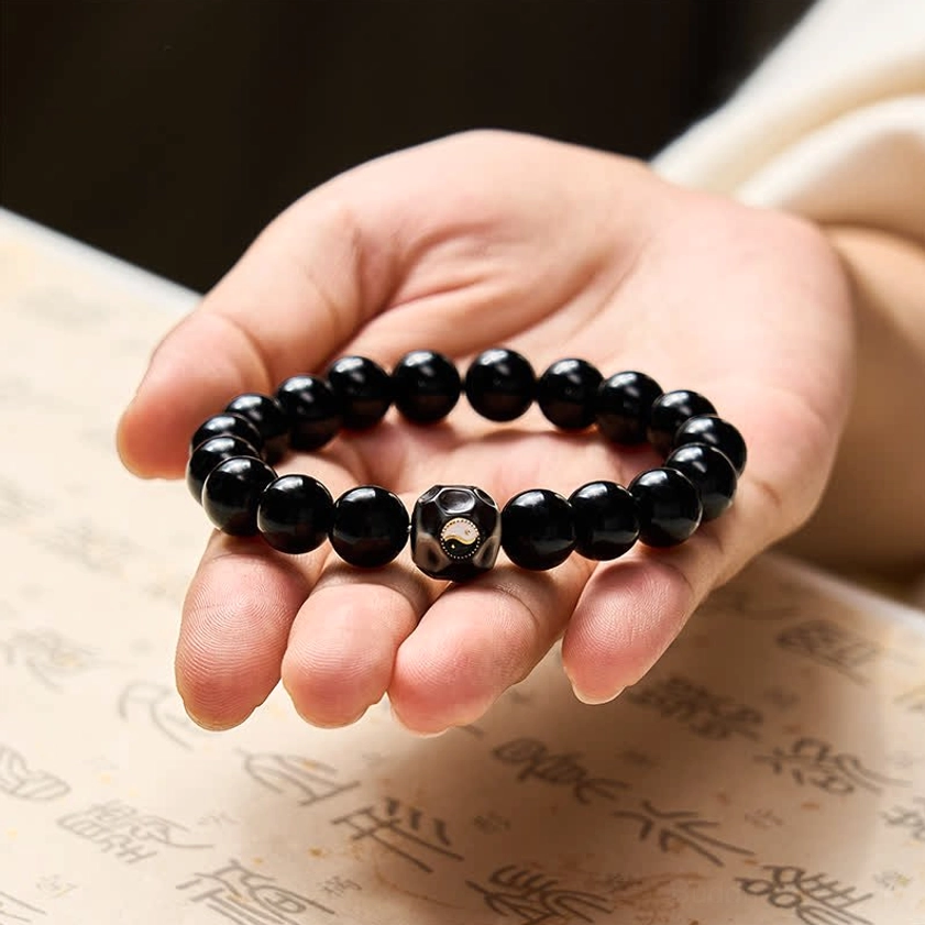 Black Onyx and Obsidian Yin Yang balance bracelet detail shot highlighting craftsmanship and stone quality