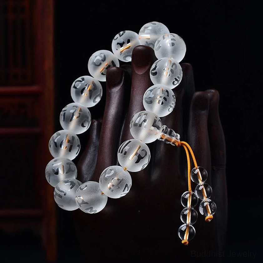 Black Onyx Om Mani Padme Hum protection bracelet displaying dark polished gemstone beads with hand-engraved sacred mantra characters