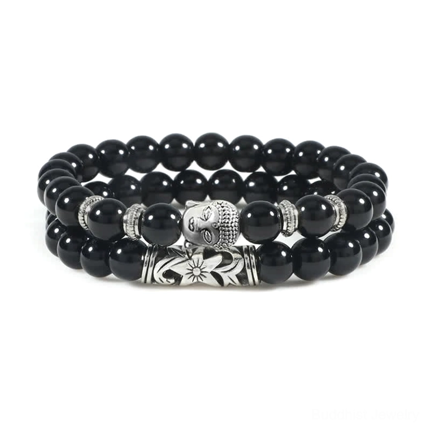Black onyx healing bracelet set with protective stone energy and engraved Buddhist symbol metal accent