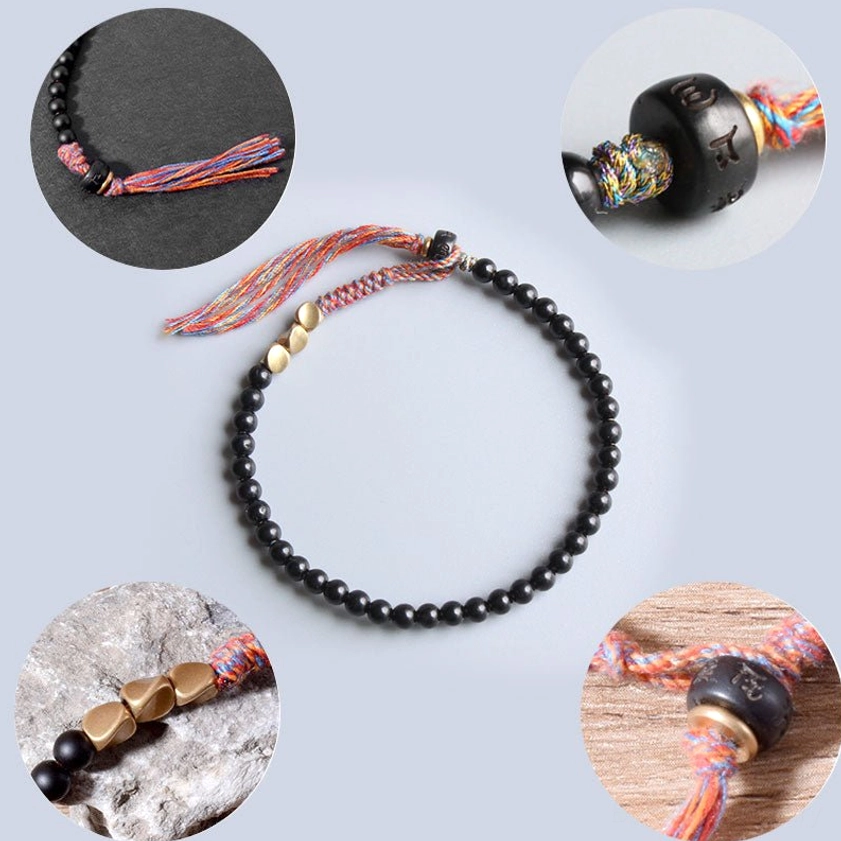 Black onyx tassel bracelet for meditation and spiritual protection, unisex handmade buddhist energy bracelet