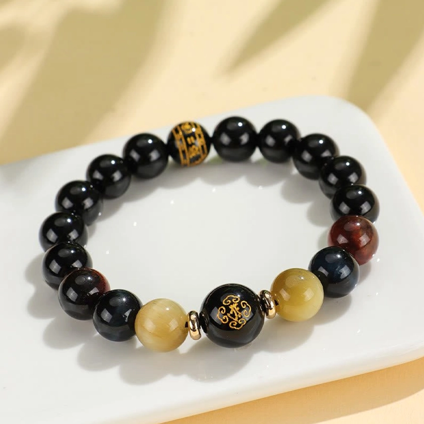 Black onyx tiger eye Buddhist bracelet worn on wrist showing comfortable fit and natural gemstone luster