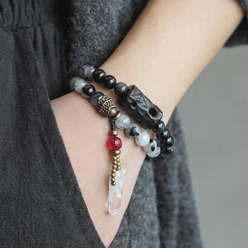 Worn Black Rutilated Quartz crystal bracelet on wrist showing ebony wood pendant and crystal tassel