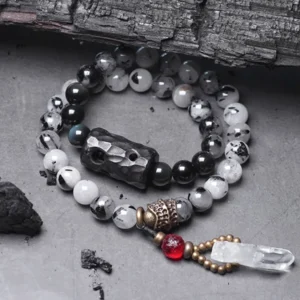 Black Rutilated Quartz White Crystal Buddhist couple bracelet flat lay top view with ebony wood charm