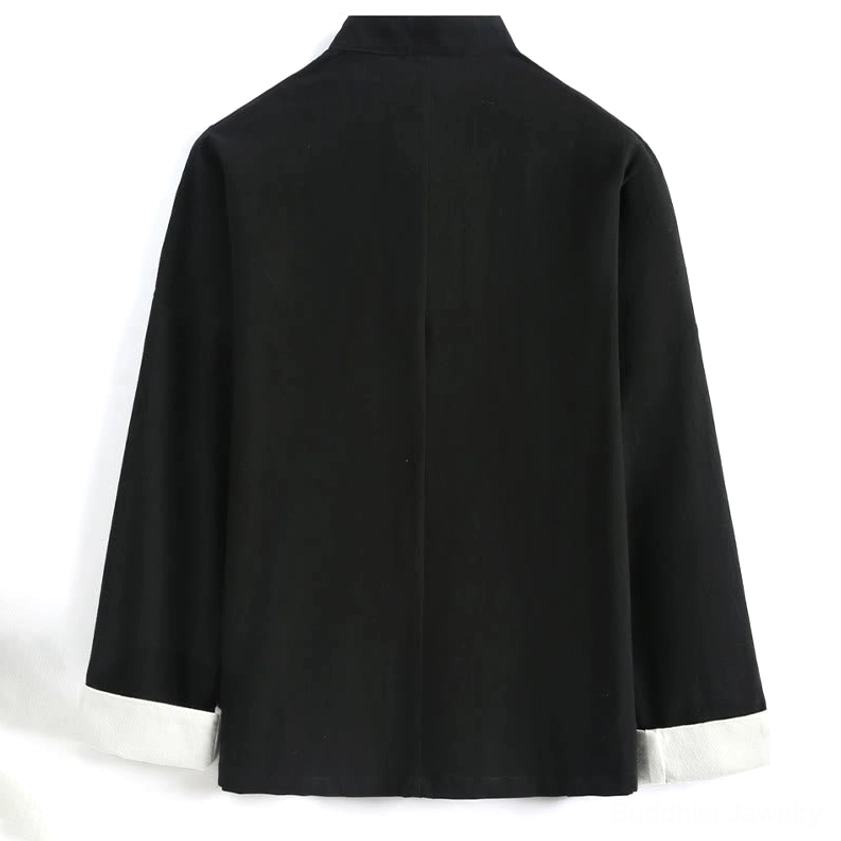 Back view of black crane embroidery Tang suit jacket with contrast white cuffs