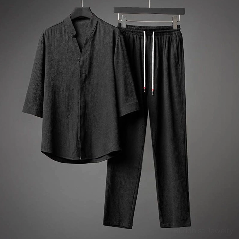 Black textured stand collar shirt and slim fit pants two-piece set, front display showing wrinkled polyester fabric
