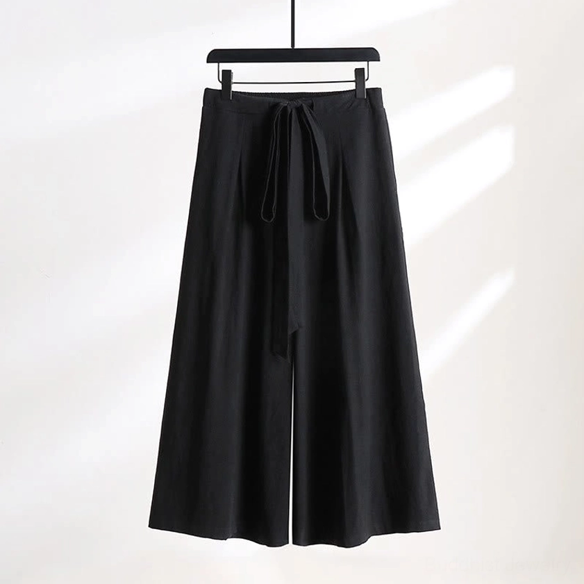 Black wide-leg meditation pants with tie waist and ankle-length design front view