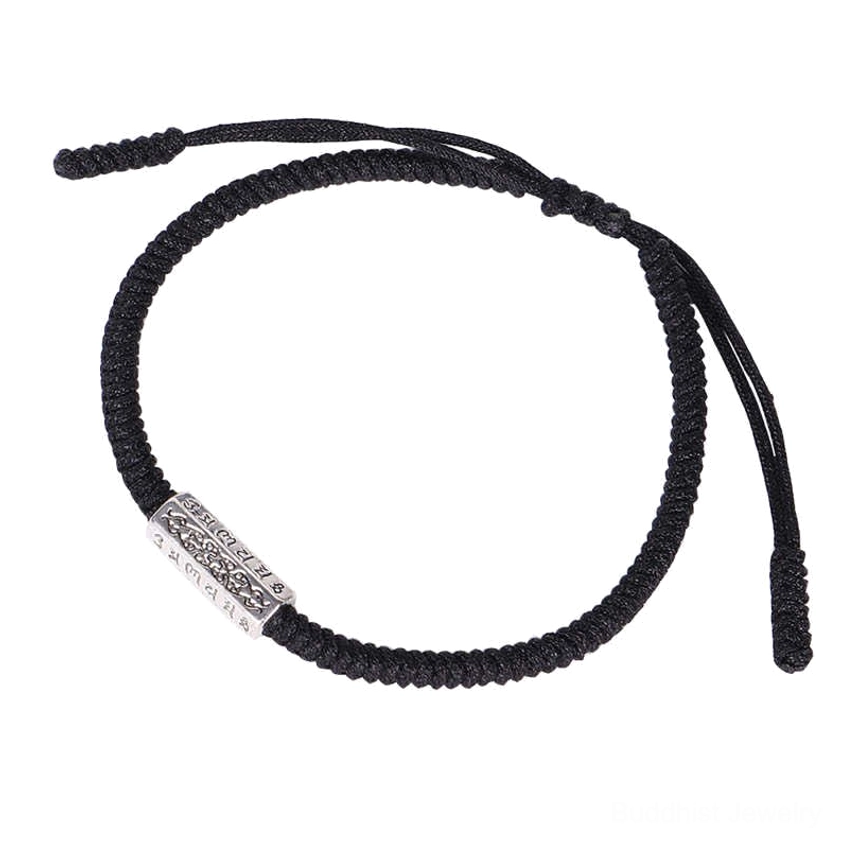 Single black woven Buddhist bracelet with vintage silver ornament and adjustable drawstring braided cord design on clean white background