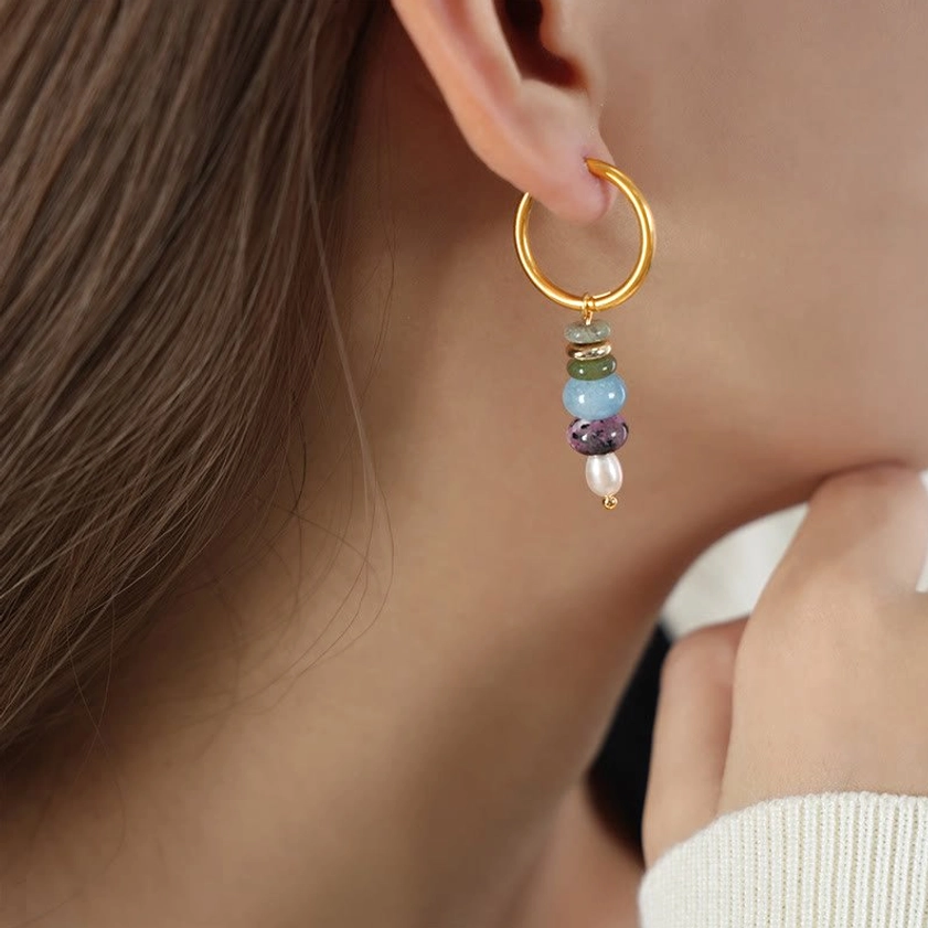 Blue natural stone agate earrings worn on neck - showing tranquility stone pendant with pearl accents