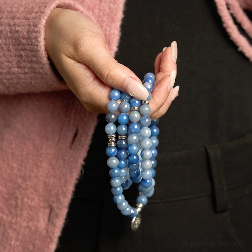 Handmade blue aventurine multi-layer mala bracelet close-up held in hand detail shot