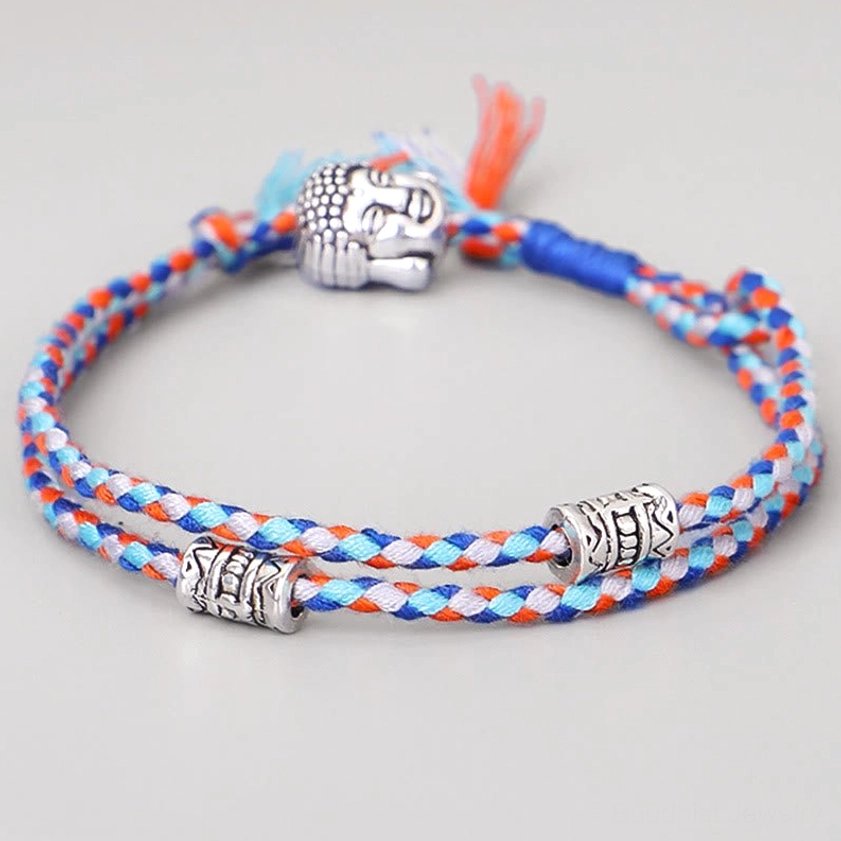 Blue Buddha head braided string bracelet with silver alloy beads and tassel, front view on white background
