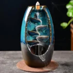 Blue ceramic dragon backflow incense burner with spiral smoke channel, front view showing glazed finish and waterfall design