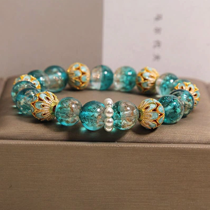 Blue glass cloisonné Buddhist bracelet with gold-patterned enamel beads and freshwater pearl accents